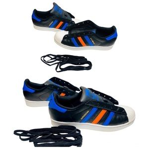 Adidas Superstar Sneakers. Colors: Black, Blue, Orange with gold Superstar logo.